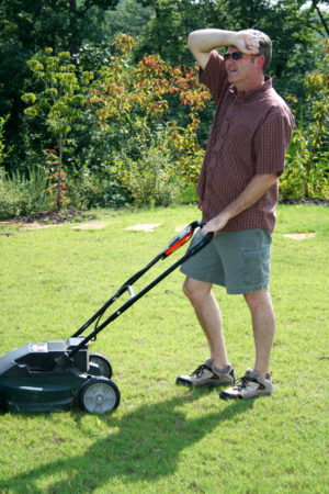 Man mows his front yard